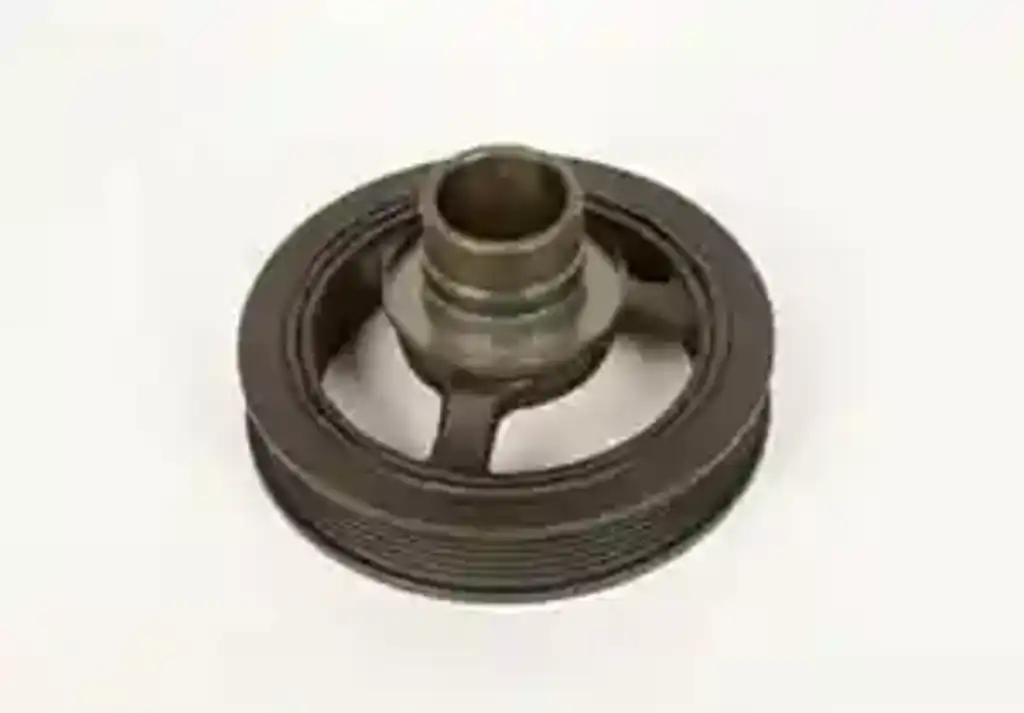 What does the engine harmonic balancer do?