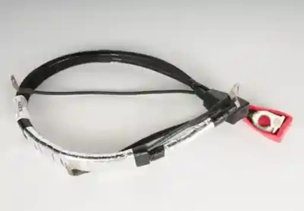 How does the harness connect to the battery?